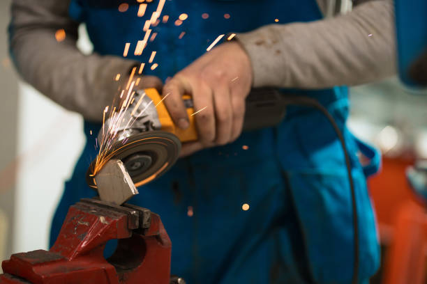 istock Worker working with a circular grinder on a metal with sparks 1423369104