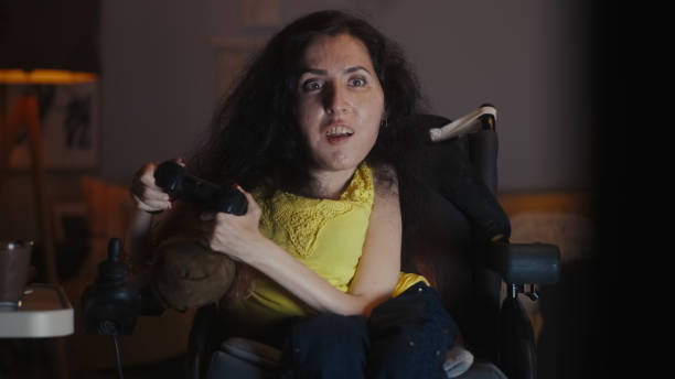 istock Woman with disability playing video game 1423370030