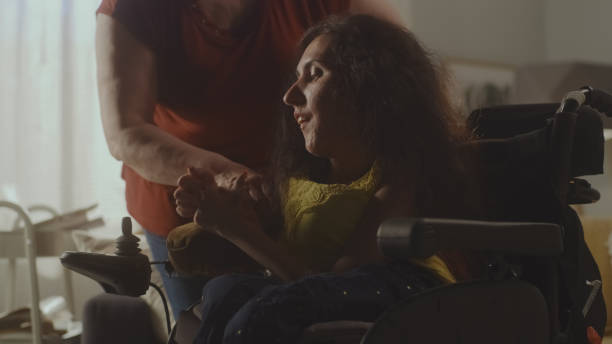 istock Mother helping daughter with a disability 1423370034