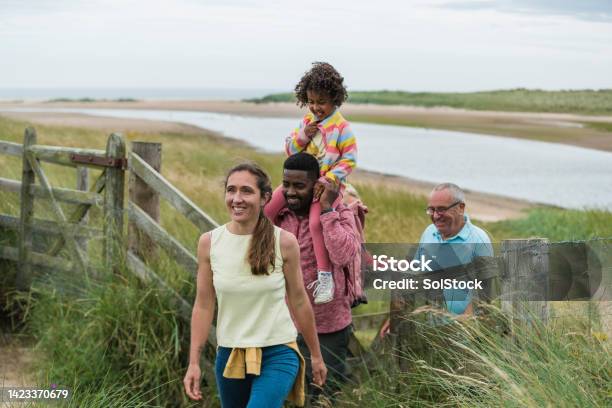 Lets Head Into The Dunes Stock Photo - Download Image Now - Coastline, Family, Sea