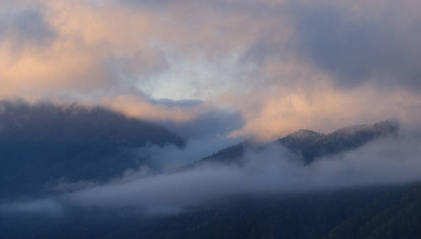istock Dawn in the mountains, fog and clouds 1423371666