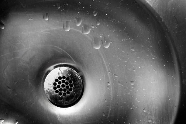 istock Old Metal Drain with Water Stains on Steel Sink 1423372021