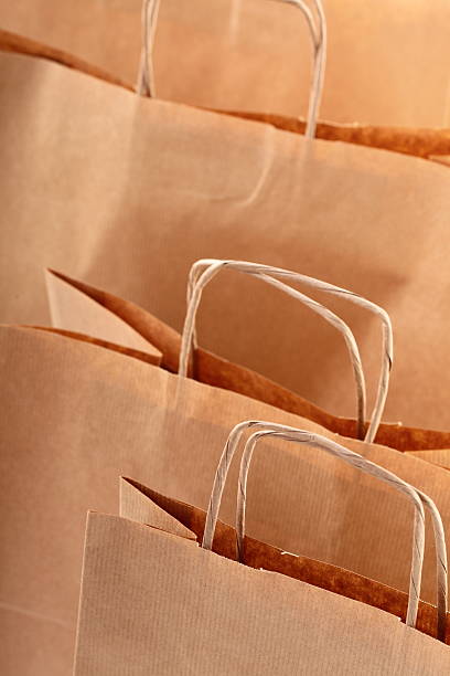 istock Shopping brown gift bags background 142337520