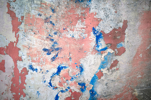 Red blue white painted plaster old grunge wall texture background, full frame