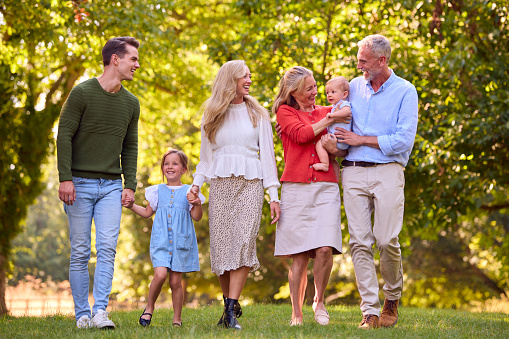 Multi-Generation Family Enjoying Walk In Countryside Together