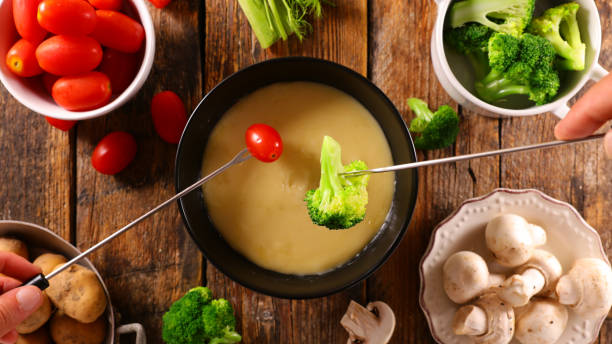 istock cheese fondue with vegetable- top view 1423377629