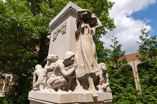 Bloomington, Illinois - United States - July 31st, 2022: The Trotter Memorial Fountain by sculptor Lorado Taft, dedicated in 1911, on a sunny Summer morning in downtown Bloomington, Illinois.
