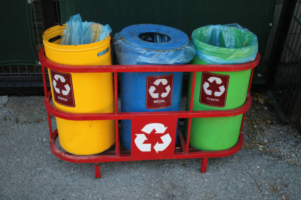 istock Green yellow and blue colored recycling bins 1423381800