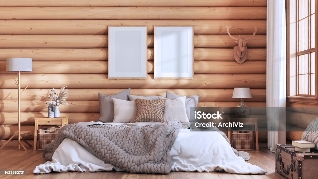 Log cabin bedroom in white and beige tones. Double bed with blanket and duvet, wooden side tables. Frame mockup, farmhouse interior design Bedroom Stock Photo