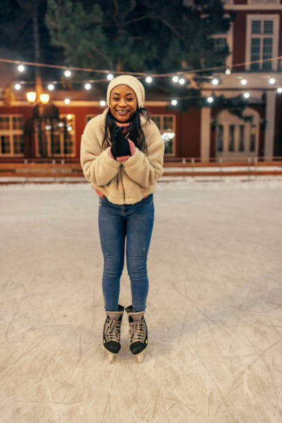 Young african woman on ice rink