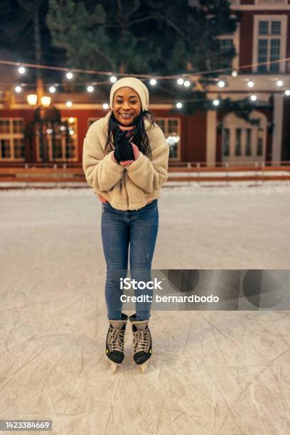 Young African Woman On Ice Rink Stock Photo - Download Image Now - Skating, Winter, Outdoors
