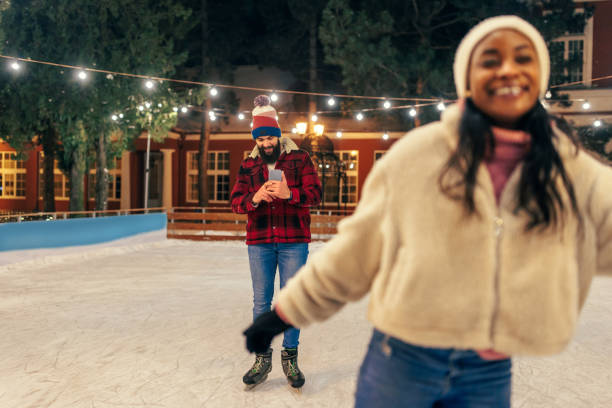 istock Boyfriend films girlfriend ice skating 1423384679