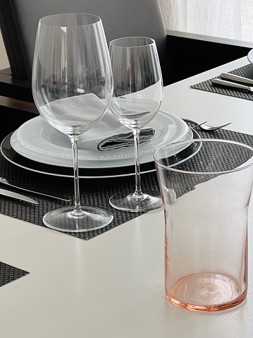 Glasses of red, rose and white wine with sunshine shadow effect. Concept of wine tasting. Flat lay, top view.