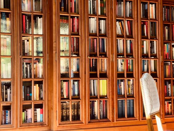 istock Bookshelves behind glass window 1423385165