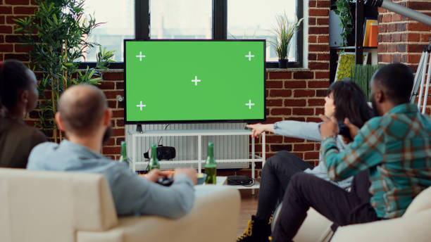 istock Group of people using greenscreen template to play video games 1423385319
