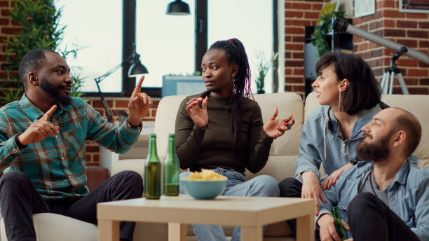istock Happy people laughing and having conversation at hangout 1423385687