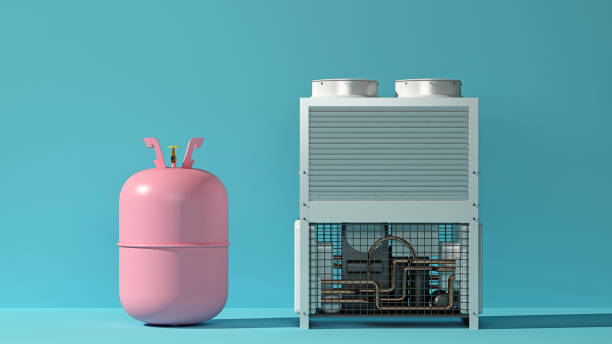 istock pink gas cylinder for refilling freon next to the air conditioning system 1423387067