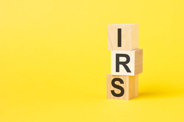 istock IRS - text on wooden cubes, on yellow background 1423387450