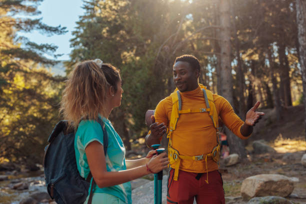 istock Hikers discussing route for hiking 1423388493
