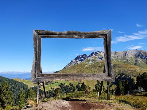 Big wooden frame in the Dolomites, Italy