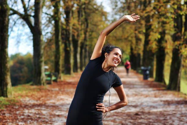 istock positive woman stretching outdoors preparing for exercise 1423394262