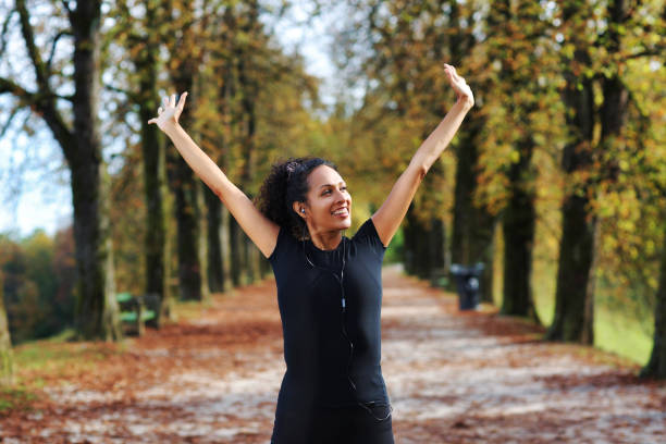 istock positive middle aged woman stretching outdoors preparing for exercise 1423394301