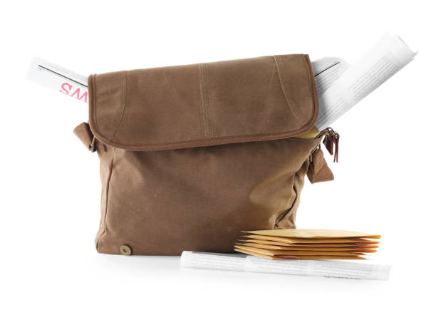istock Brown postman's bag, envelopes and newspapers on white background 1423394478