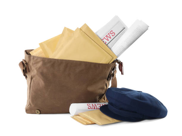 istock Brown postman's bag with envelopes, newspapers and hat on white background 1423395301