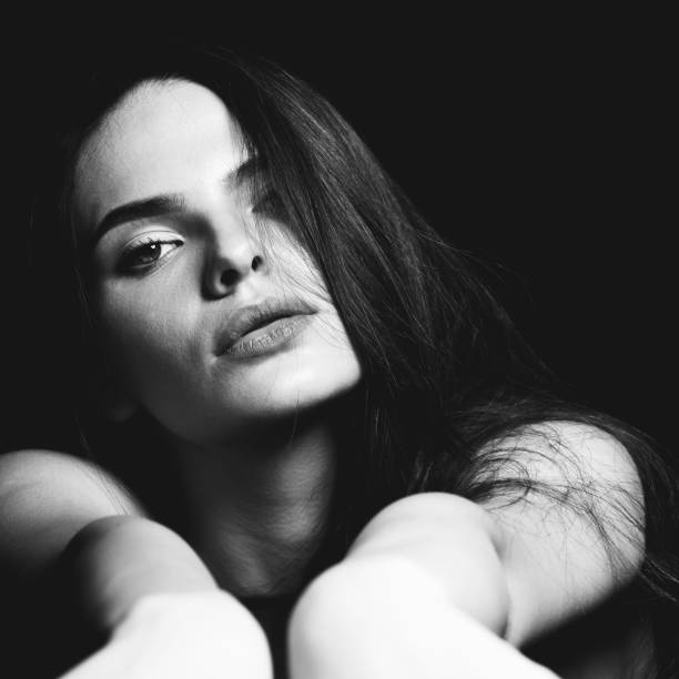 istock Sensual looking beautiful woman close-up studio portrait 1423396995