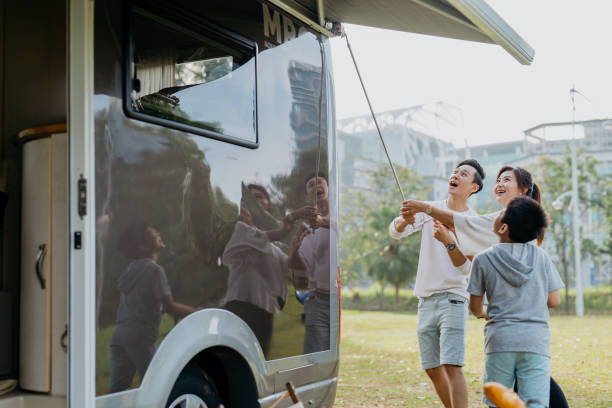 istock Asian Chinese family setting up awning on a caravan 1423397487