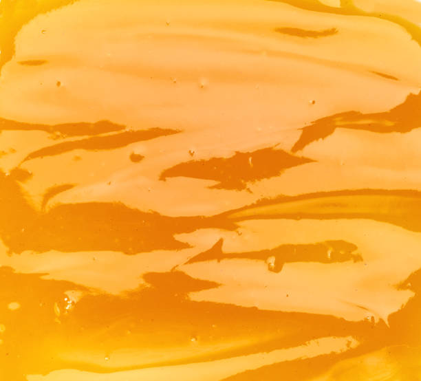 istock Orange sweet and sour sauce  texture background,top view 1423398268