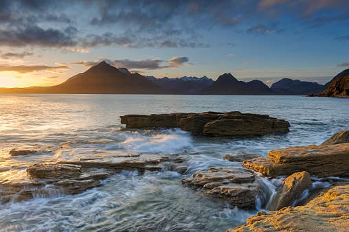 Wide angle view of dusk at dramatic Elgol Beach on The Isle of Skye, Scotland, UK.