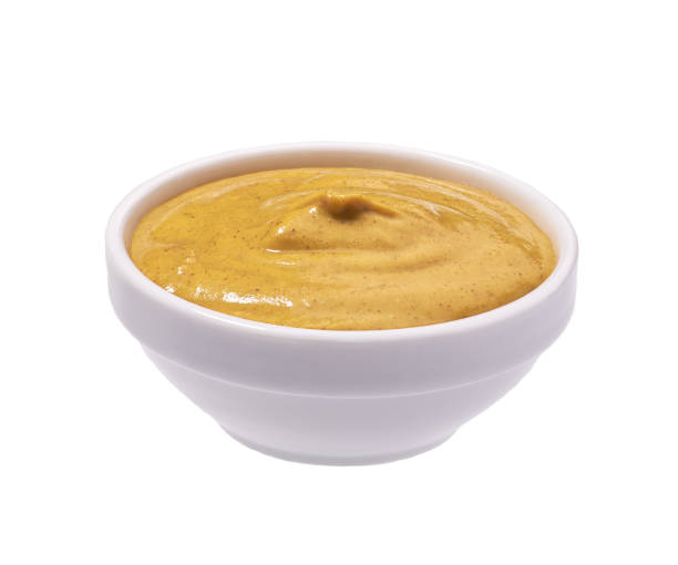 istock Mustard sauce in ceramic bowl isolated on white 1423400623