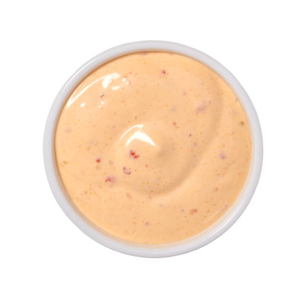 istock Paprika sauce in ceramic bowl isolated on white background.Top v 1423400744