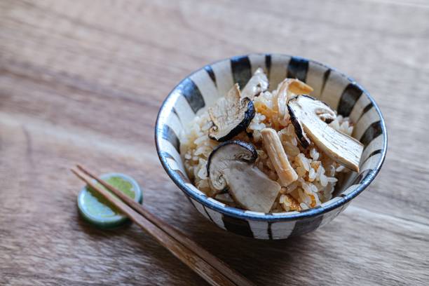 Rice cooked with matsutake mushrooms, a luxury ingredient Matsutake mushrooms are a luxury food in Japan.It is an ingredient representative of the taste of autumn. matsutake mushroom stock pictures, royalty-free photos & images