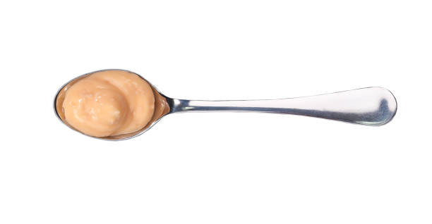 istock Shrimp sauce in small metal spoon  isolated on white background,top view 1423401891