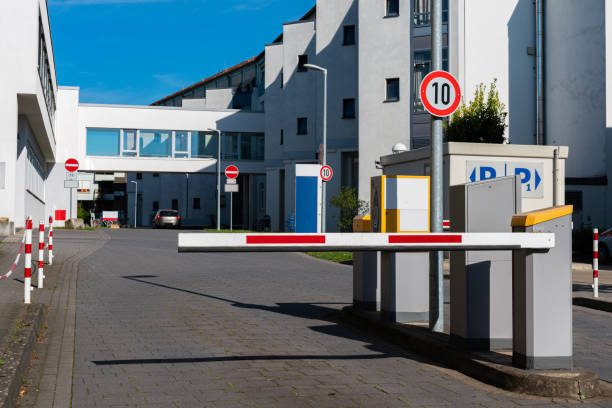 istock Barrier blocking the road to paid parking inside the yard. 1423402012