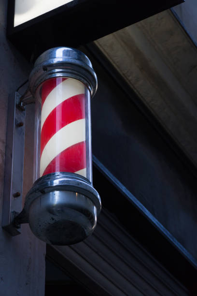 istock red and white advertising pillar indicating barbershop 1423402552