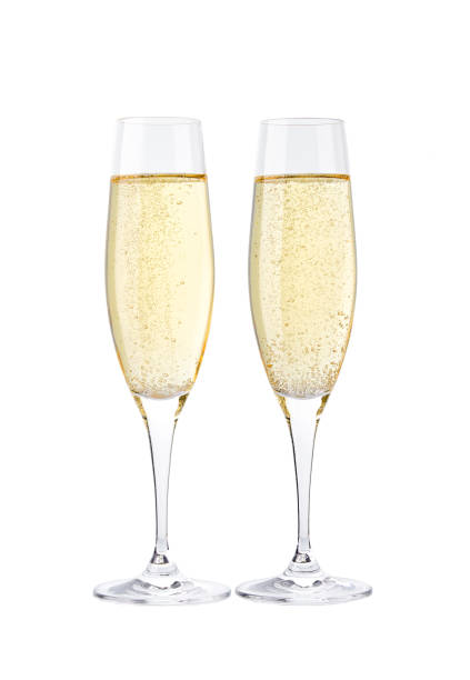 istock Two glasses of champagne isolated on white background 1423402571