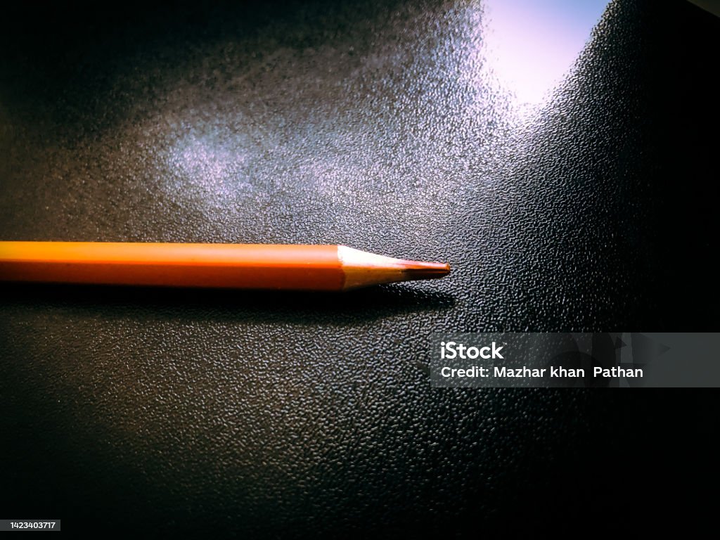 (Nostalgia) Work hard in silence and get success Colour pencil with black background. Concentration and silence can even make you nostalgic. 2015 Stock Photo