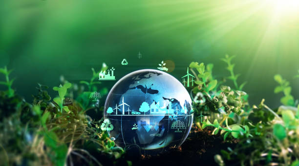 Green energy for clean and sustainable environment. Wind energy used in the industry of factories, machines and technologies. Reducing Co2 emissions and limiting global warming and climate change stock photo