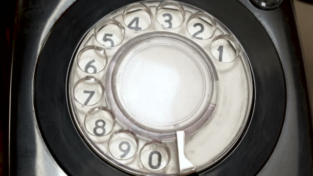 Closeup on dialing Using A vintage  Rotary Phone