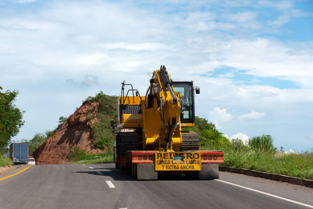 construction vehicle driving down road