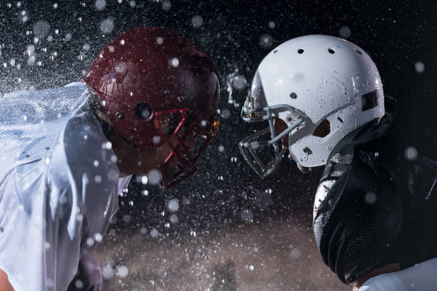 two american football players face to face in silhouette shadow on white background - real people blue white friendship imagens e fotografias de stock