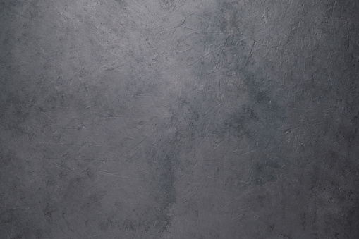 Empty concrete background. Dark gray beton backdrop loft design. Copy space and top view image.