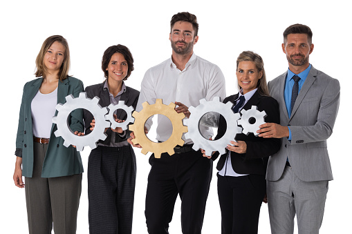 Group of happy business people holding cogwheels teamwork cooperation oncept isolated on white background