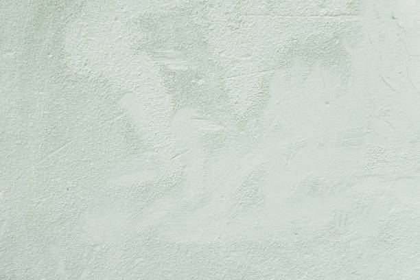 istock White grunge old concrete stucco wall texture background. Abstract weathered gray cement scratched building wall background 1423410741