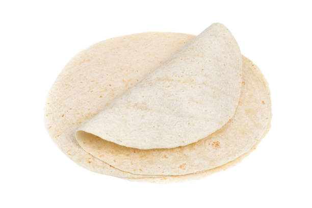 istock Tortilla on a white background. Thin flatbread close-up on a white background. 1423411733