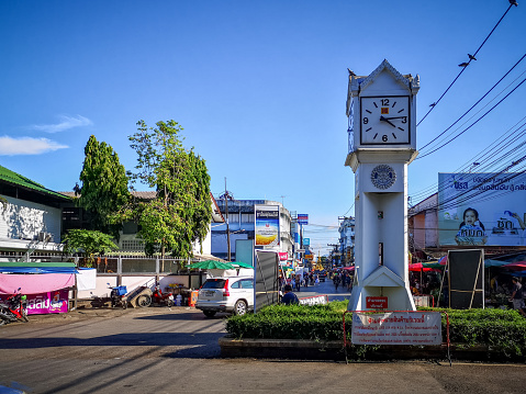 Chiang Rai, Thailand - September 16, 2019: White old clock tower at city center of Chiang Rai