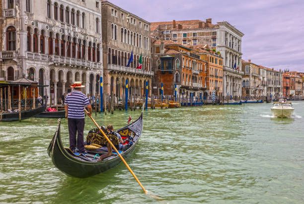 Venice grand canal tourist gondolas, Italy Venice, Italy - Aug 22, 2022: Venice grand canal tourist gondolas. gondolier stock pictures, royalty-free photos & images